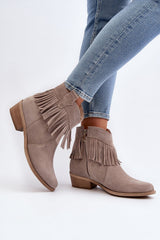 Natural leather heel boots decorated with tassels