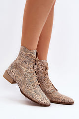 Heeled low natural leather boots