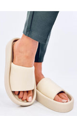 Soft beige flip-flops on a rubber sole