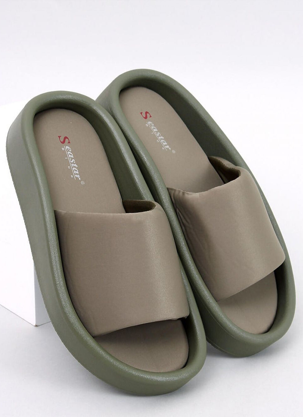 Soft green flip-flops on a rubber sole