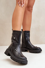 Black boots decorated with fashionable elements