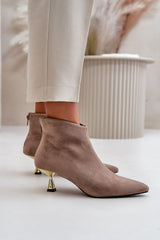 Stylish ankle boots on a decorative heel