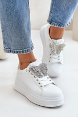 White sneakers with decorative shiny butterfly