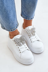 White sneakers with decorative shiny butterfly