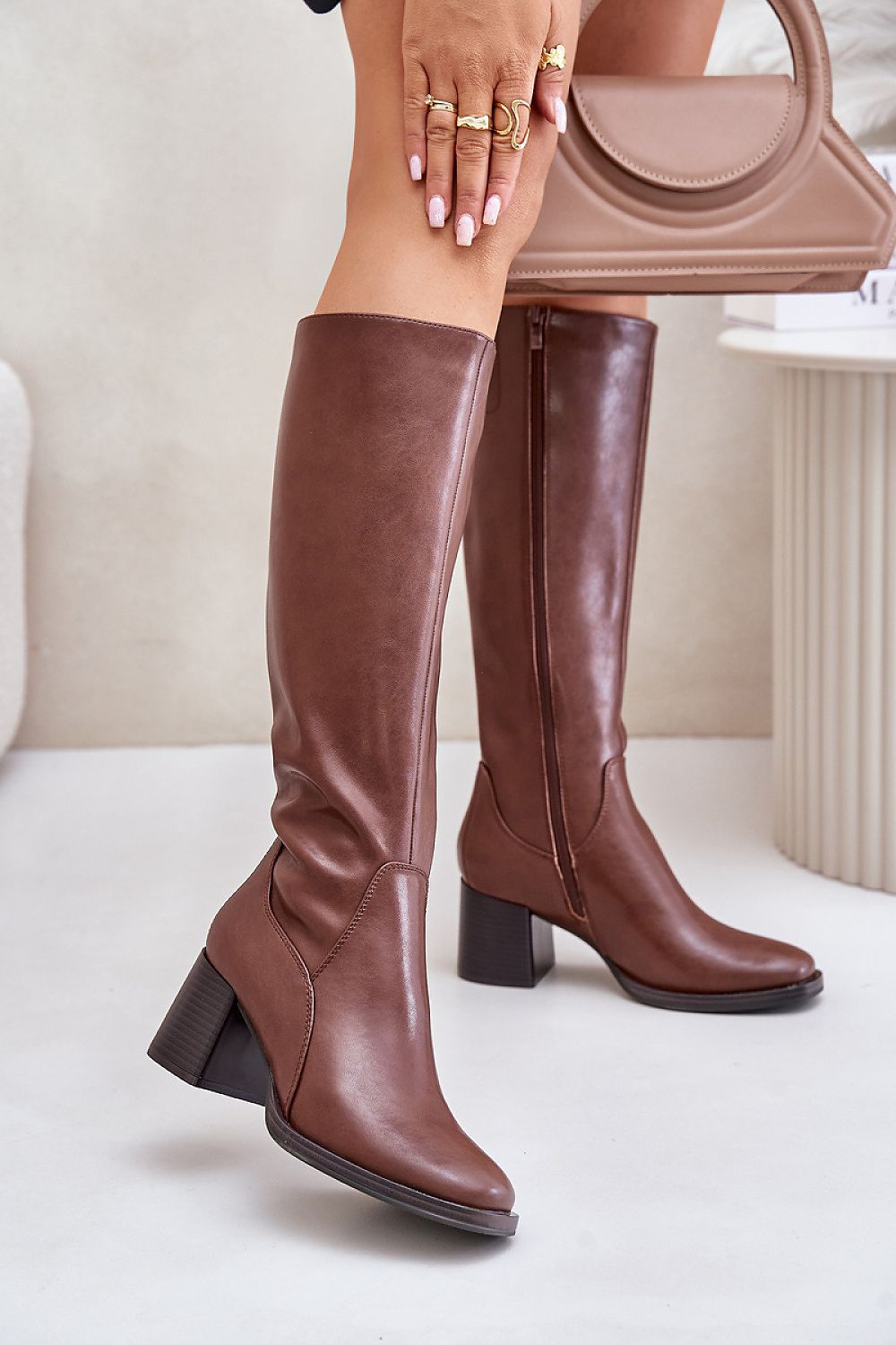 Elegant leather knee-high heel boots