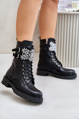 Stylish black boots with decorated belt