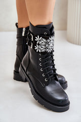 Stylish black boots with decorated belt