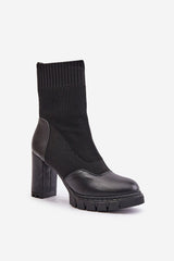 Black ankle boots with a sock-like upper