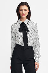 Long sleeve shirt with a black sash