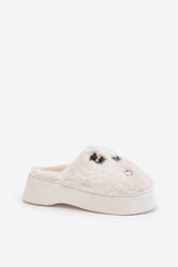 Women's fur slippers on a thick platform