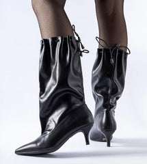 Stiletto black heeled boots