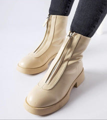 Beige insulated ankle boots with a zipper