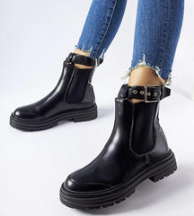 Black ankle boots with decorative fastening