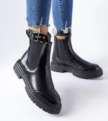 Black ankle boots with decorative fastening