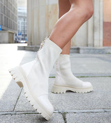 Beige sock-style patent leather ankle boots