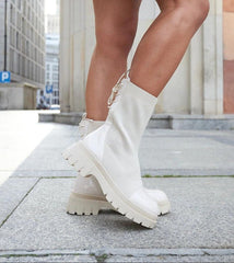 Beige sock-style patent leather ankle boots