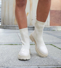 Beige sock-style patent leather ankle boots