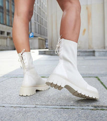 Beige sock-style patent leather ankle boots