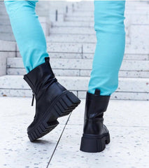 Black lined ankle boots with a zip