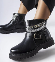 Black ankle boots with decorative chains