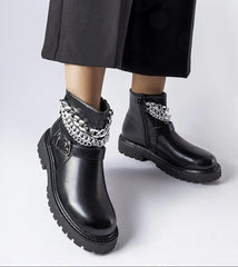 Black ankle boots with decorative chains