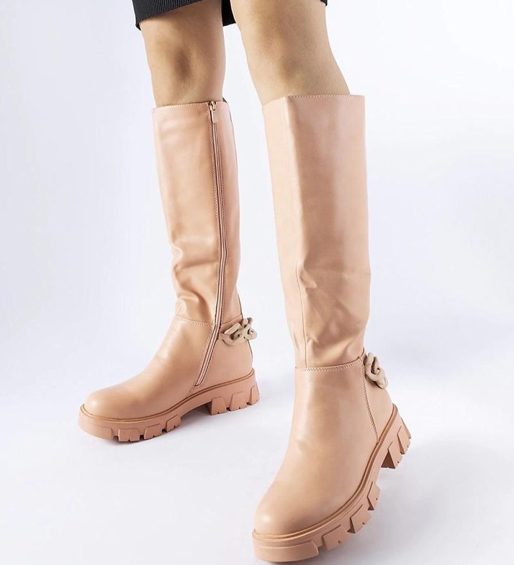 Pink flat knee-high boots with a chain