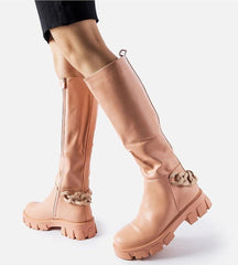 Pink flat knee-high boots with a chain