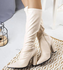 Beige high post pointed nose heel boots