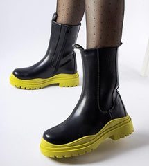 Black ankle boots with a colorful sole