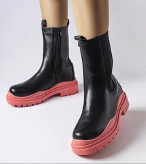 Black ankle boots with a colorful sole