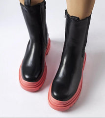 Black ankle boots with a colorful sole