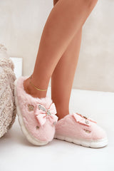 Charming buttons and a bow furry slipper