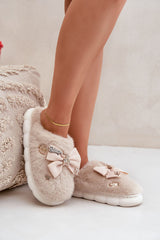 Charming buttons and a bow furry slipper