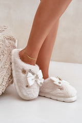 Charming buttons and a bow furry slipper