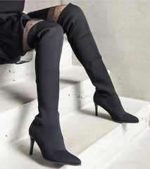 Black slip-on heel boots with elastic upper