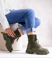 Green boots with elastic upper