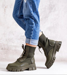 Green boots with elastic upper