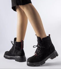 Black boots decorated with red trim