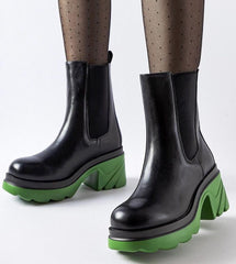 Black insulated boots with a green post