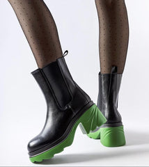 Black insulated boots with a green post