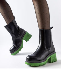 Black insulated boots with a green post