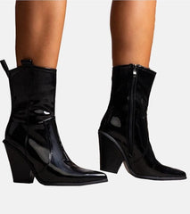 Elegant stylish black lacquered heel boots