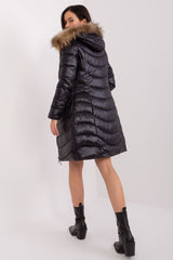 Black quilted jacket with fur-lined hood