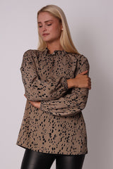 Beige long-sleeve blouse with an animal pattern