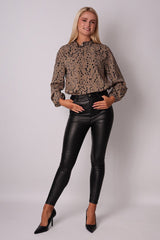 Beige long-sleeve blouse with an animal pattern